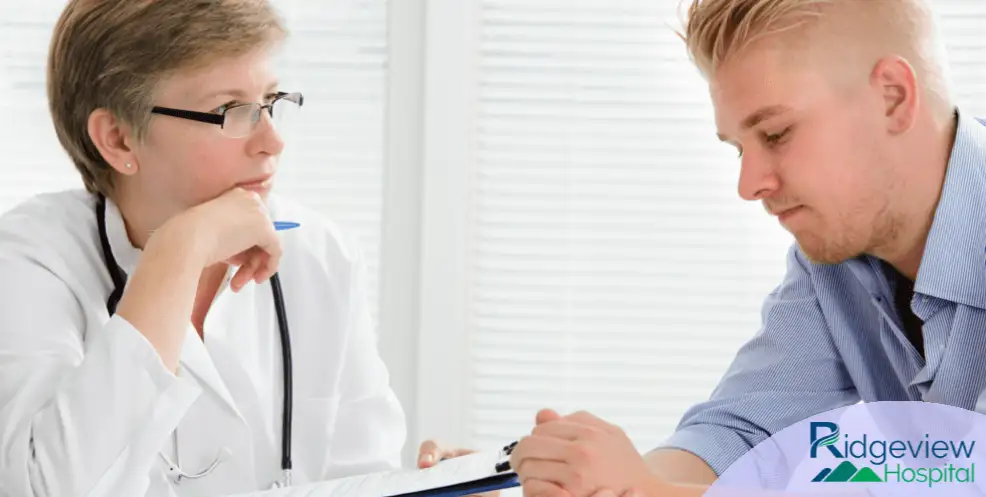 Doctor talking with patient