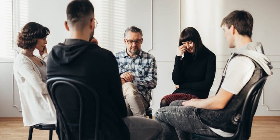 Group meeting at Rehab facility - people talking about the benefits of group therapy