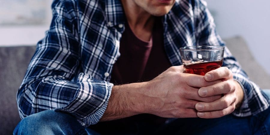 Man holding alcohol drink