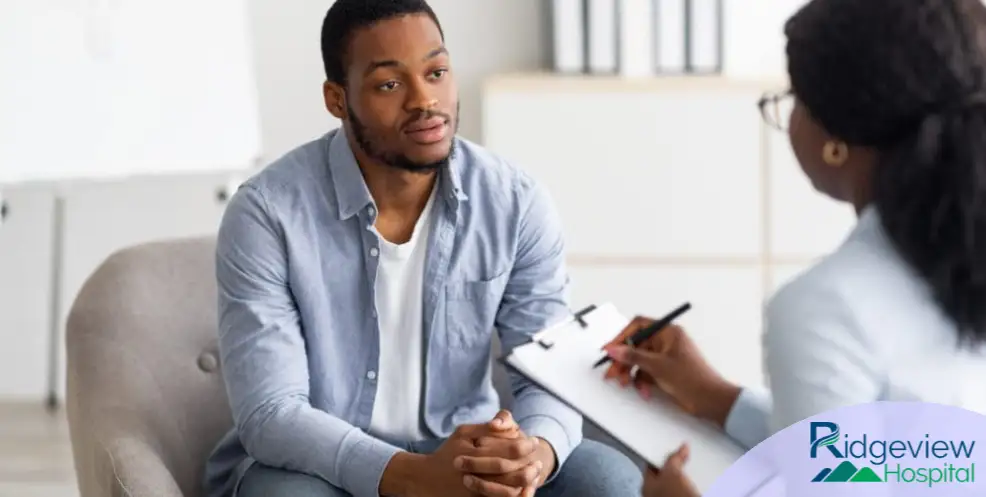 Man talking with doctor at Ridgeview Hospital