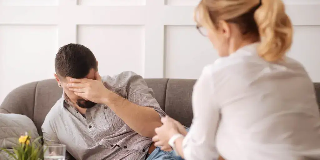 Man talking with therapist