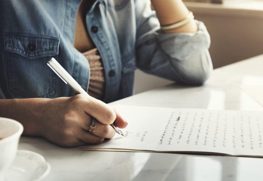 Person writing a letter