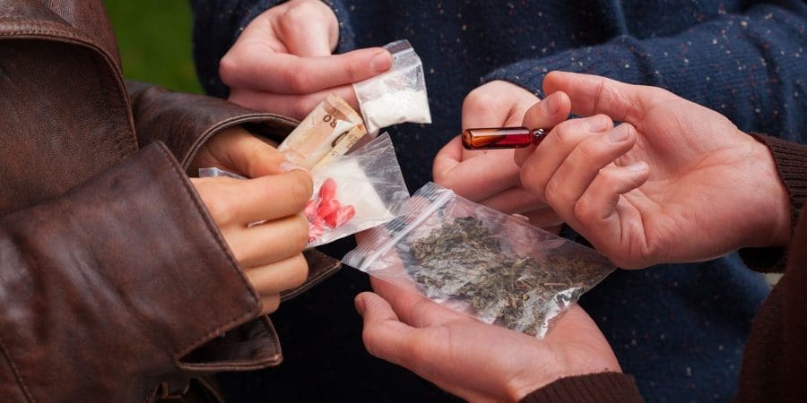 Teens buying selling drugs on the streets