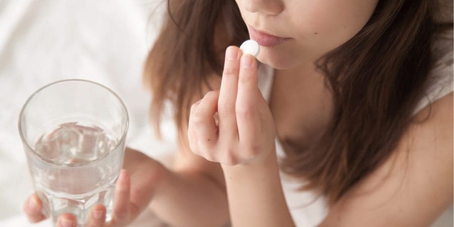 Woman taking prescription for anxiety