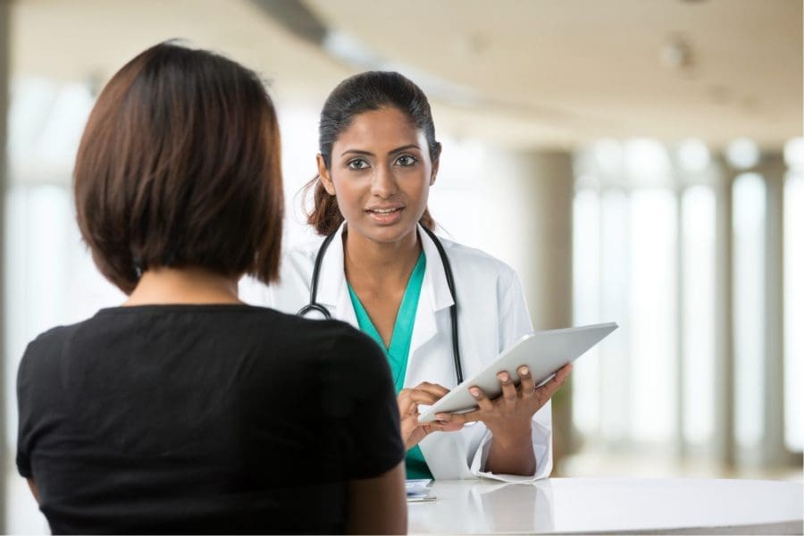 doctor talking with patient at Middle Point Rehab