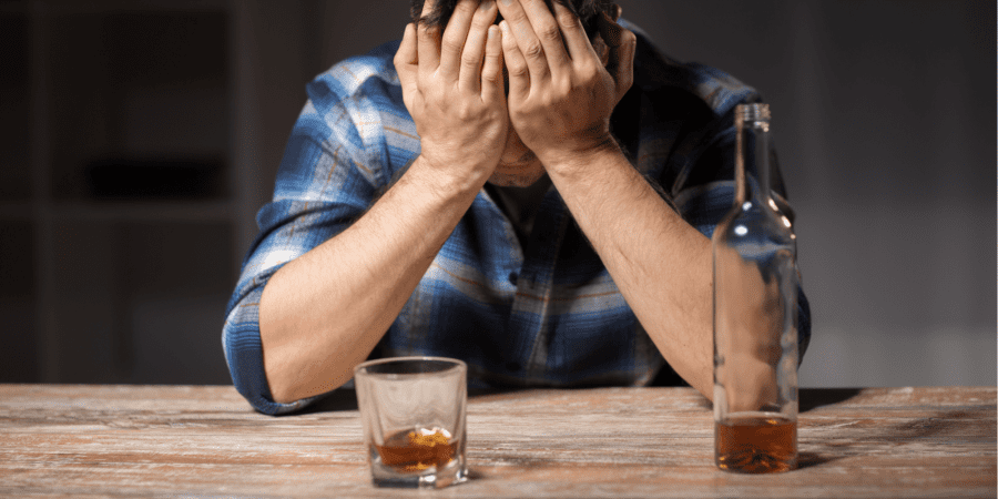man drinking alcohol having a relapse