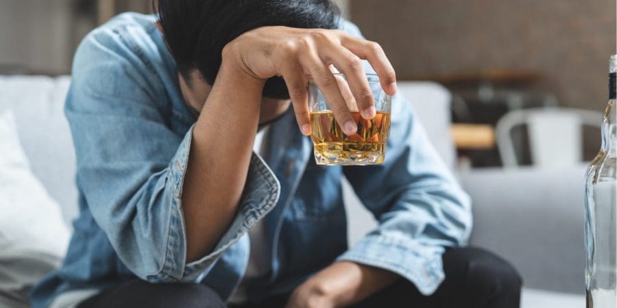 man holding alcohol drinking